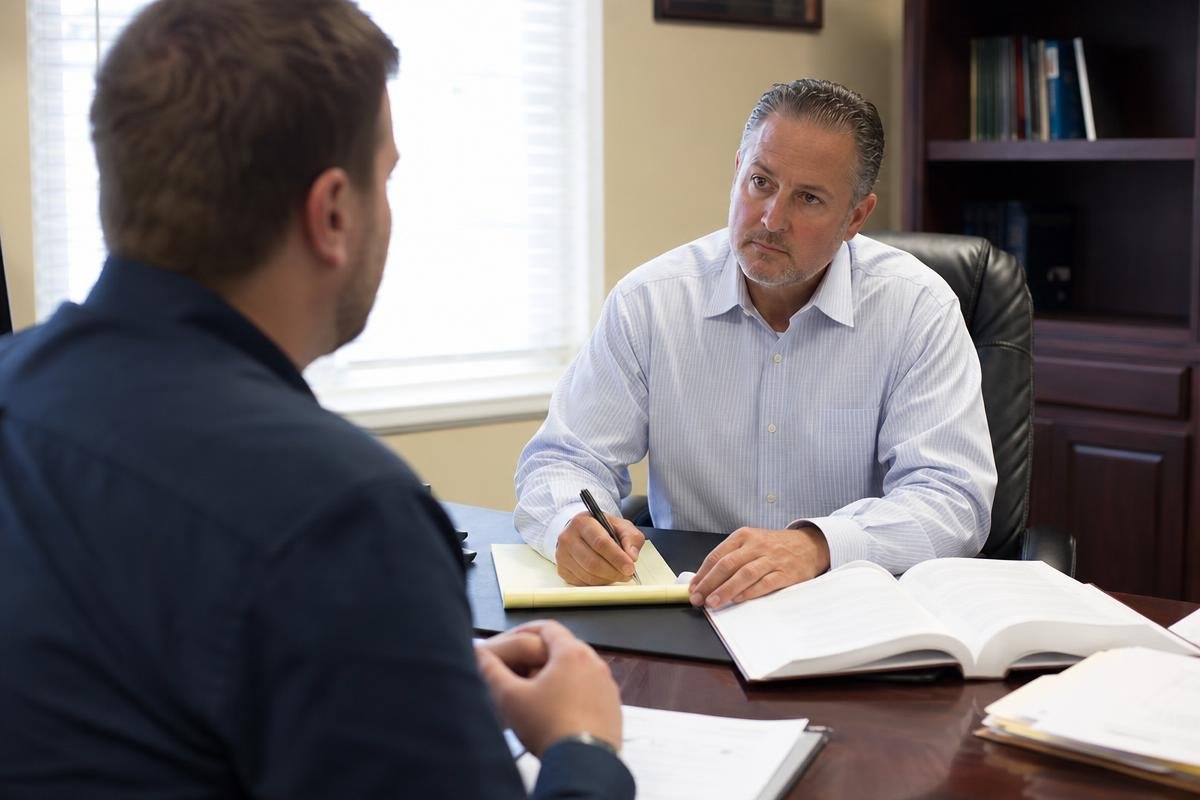 DUI attorney Alexandria, VA reviewing case with client