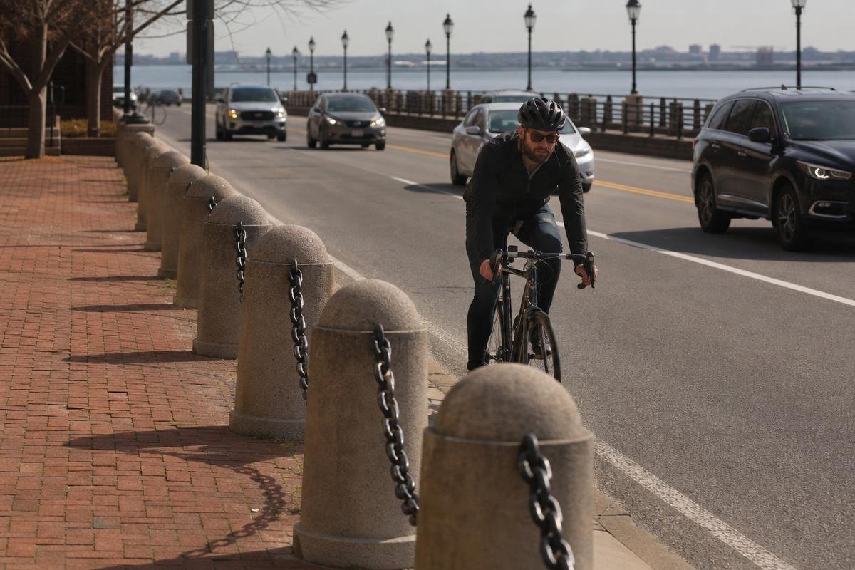 Cyclist injury lawyer in Alexandria reviewing dangerous road conditions