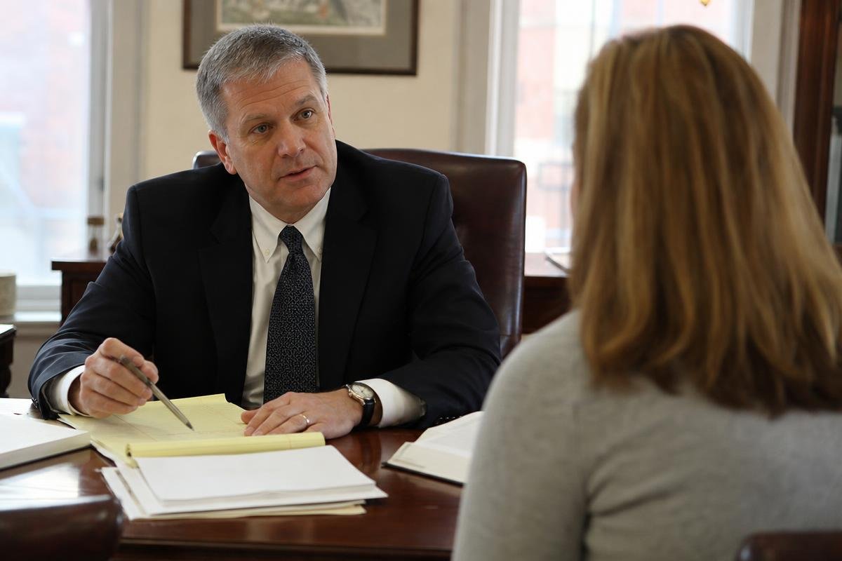Criminal defense lawyer explaining the Virginia court process to a client